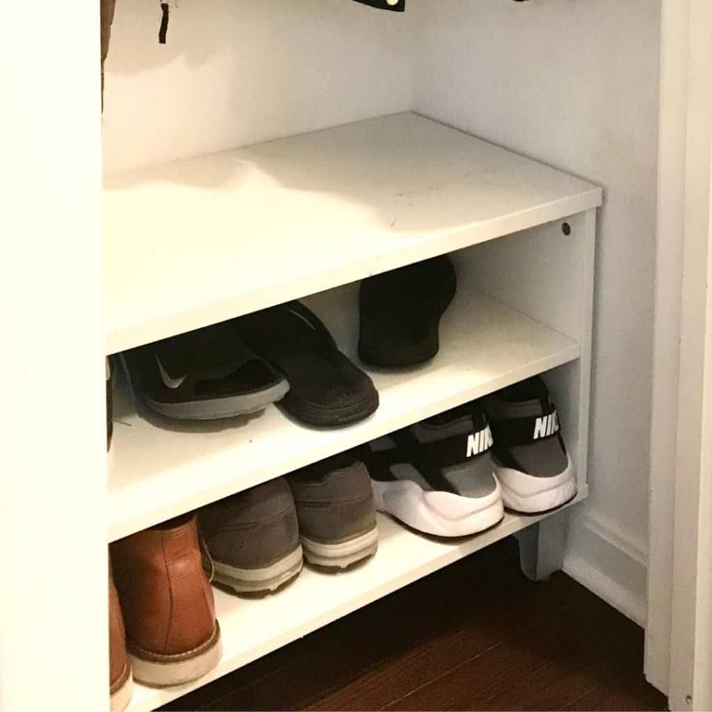 turning closet into mudroom with a shoe storage bench