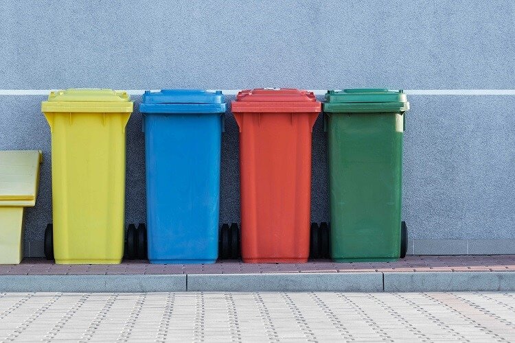 different colored trash bins