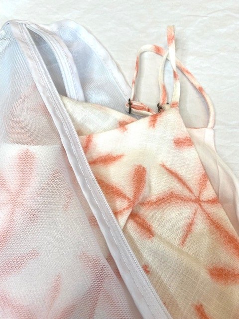 coral starfish shirt in mesh laundry bag