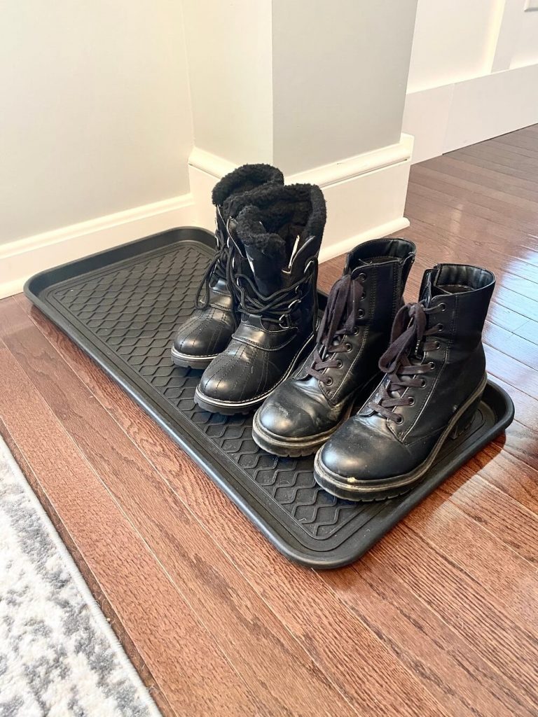 black boot tray with boots for winter mudroom ideas