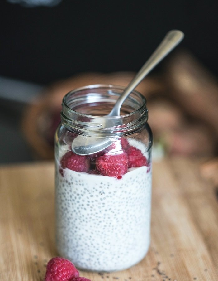 glass jar with white pudding and chia seeds