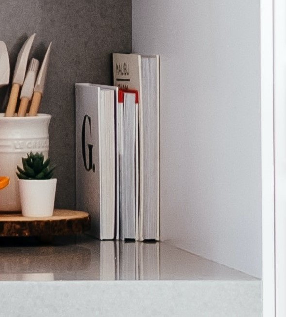 take cookbooks off kitchen countertops to declutter your space