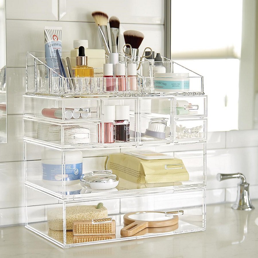 acrylic drawers filled with makeup up, makeup brushes and other bathroom items