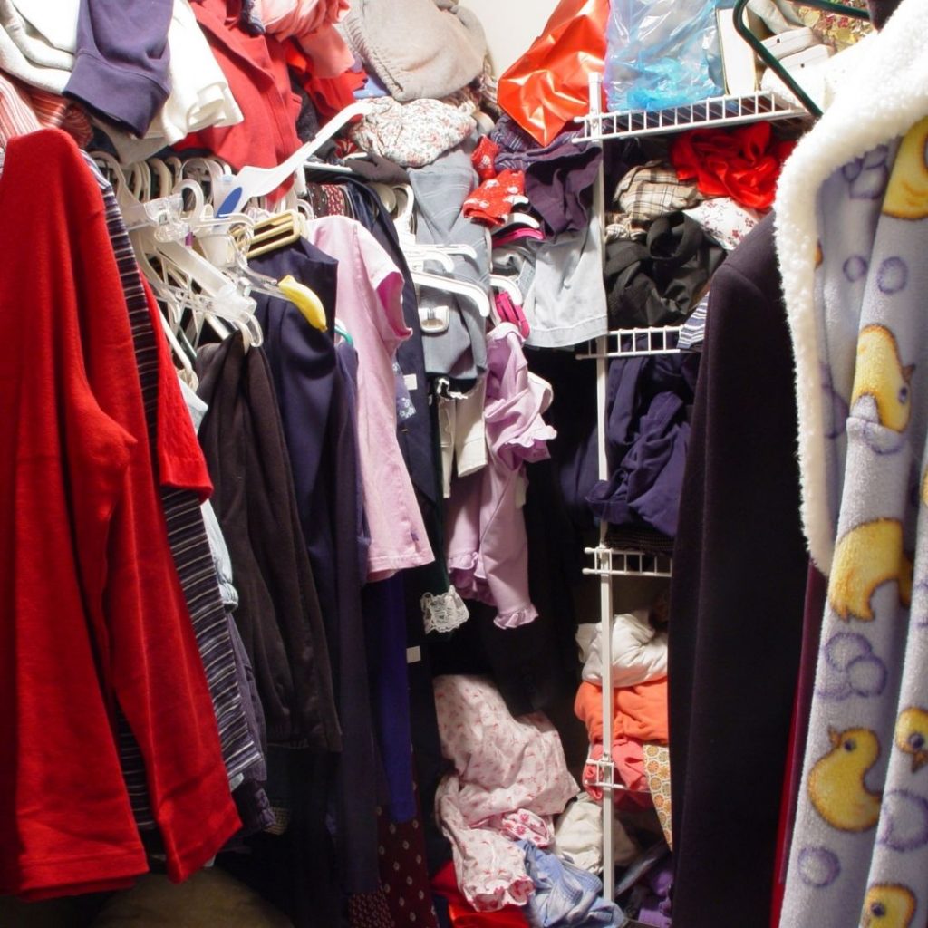 messy closet that needs clothing purged