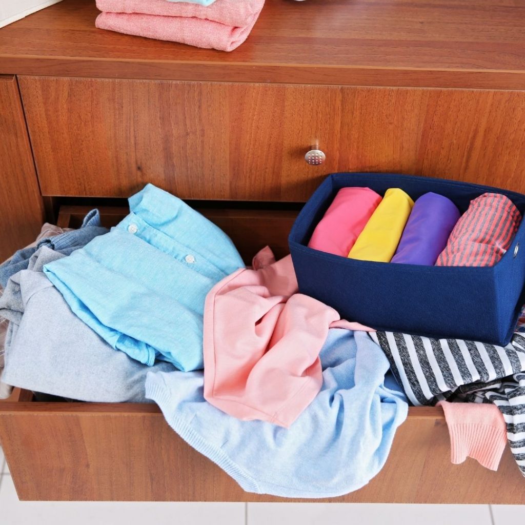 purge clothes in overflowing drawers like this one