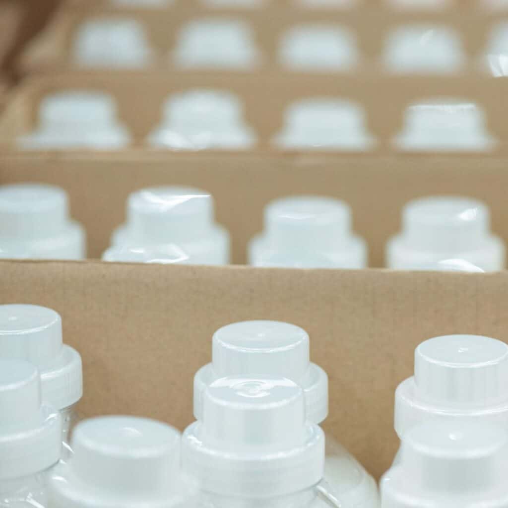 rows of bottles of plastic fabric softener bottles
