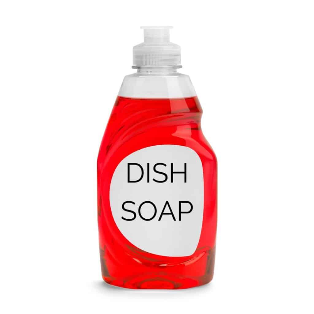 bottle of dish soap for getting massage oil stains out of sheets
