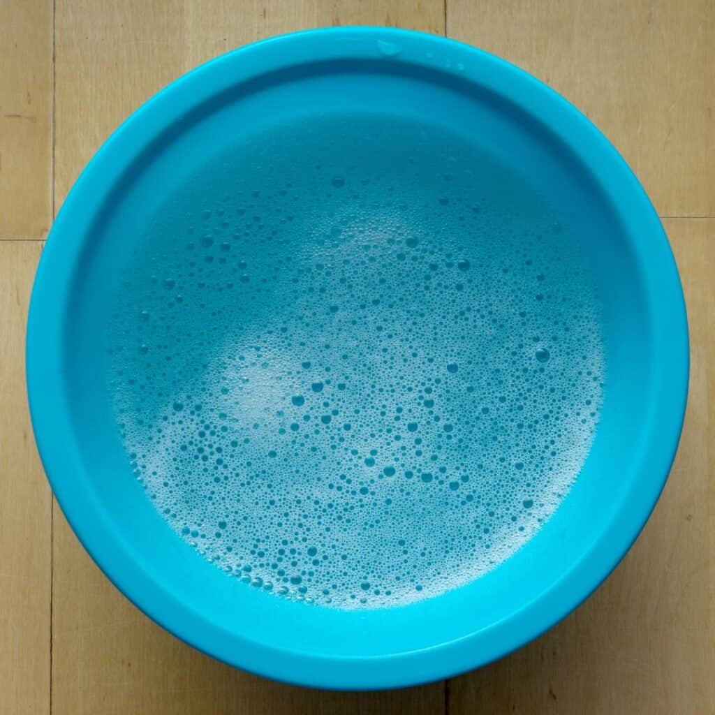 blue bowl with soapy water